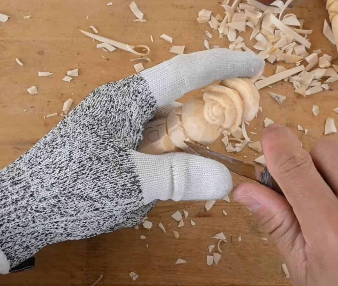 carving the arms on a mrs claus figure