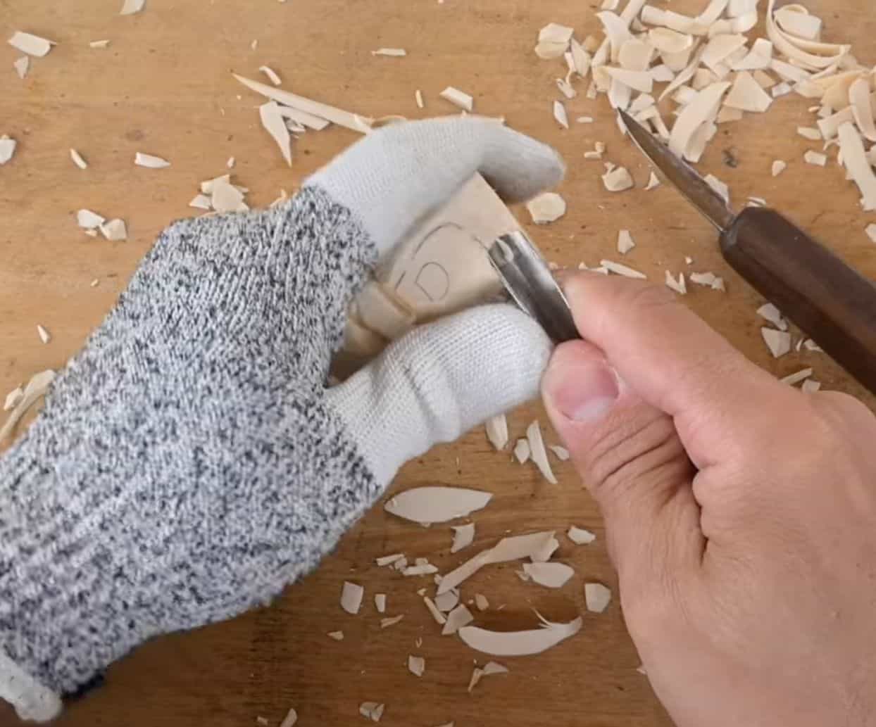 carving an apron on a mrs claus figure