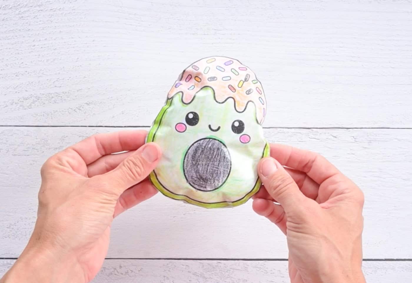 hands holding a completed paper squishy craft