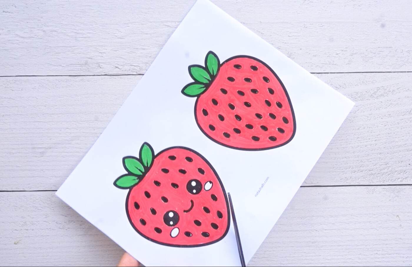 cutting out printable strawberry templates for making a squishy