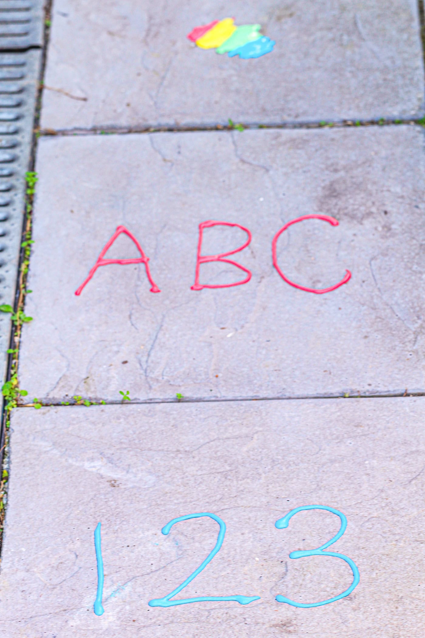 puffy sidewalk paint used to paint ABC and 123 on the sidewalk