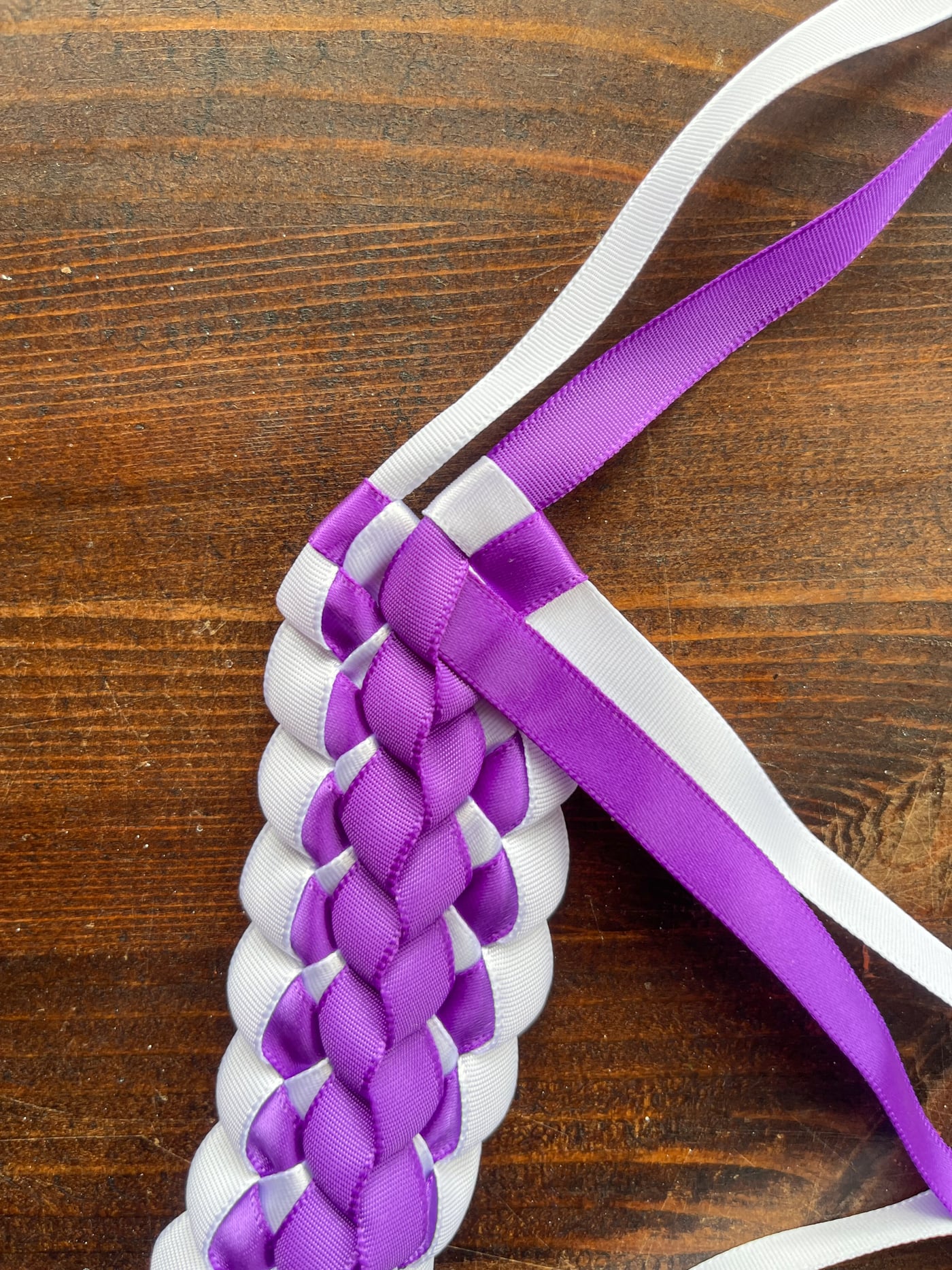 secured ribbons ending off a Hawaiian ribbon lei