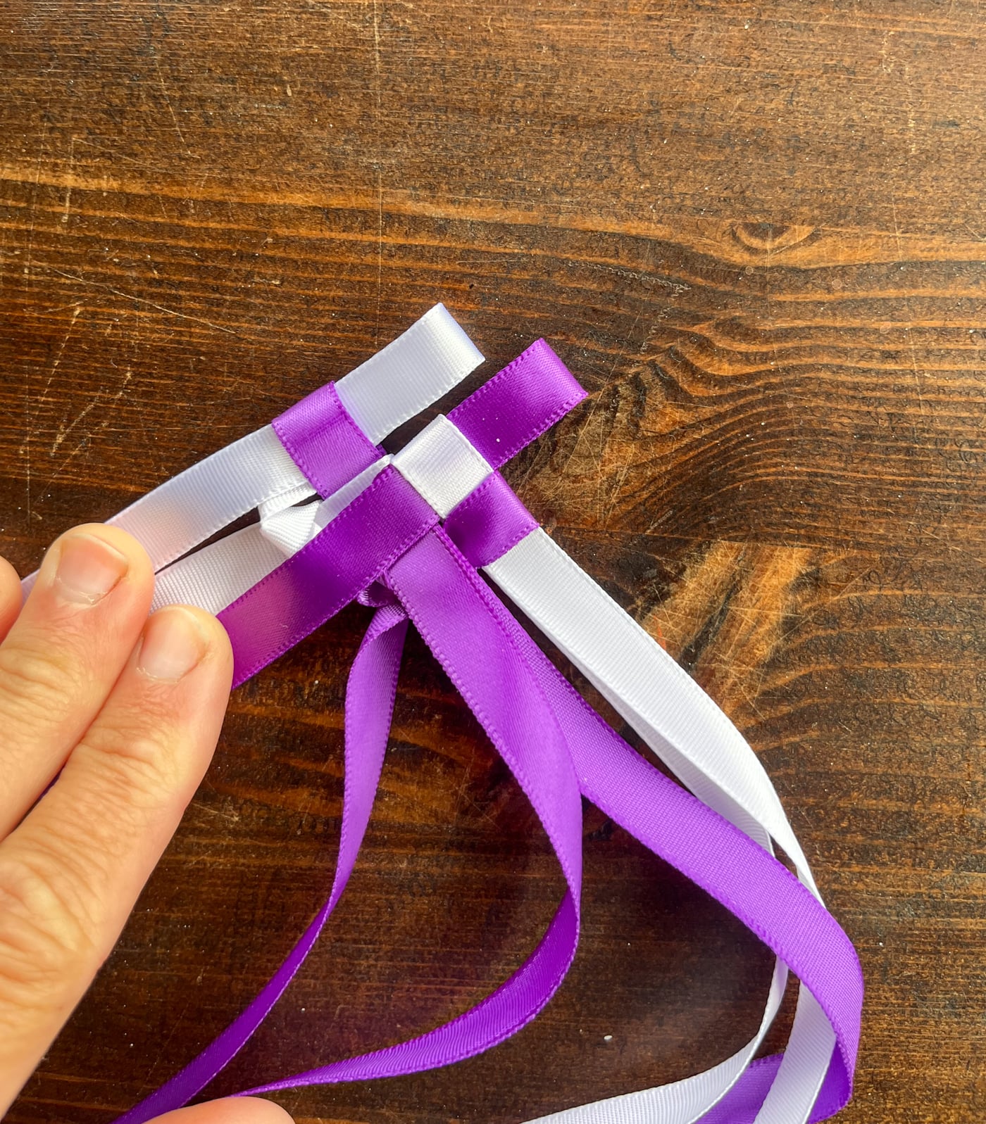 braiding a Hawaiian ribbon lei