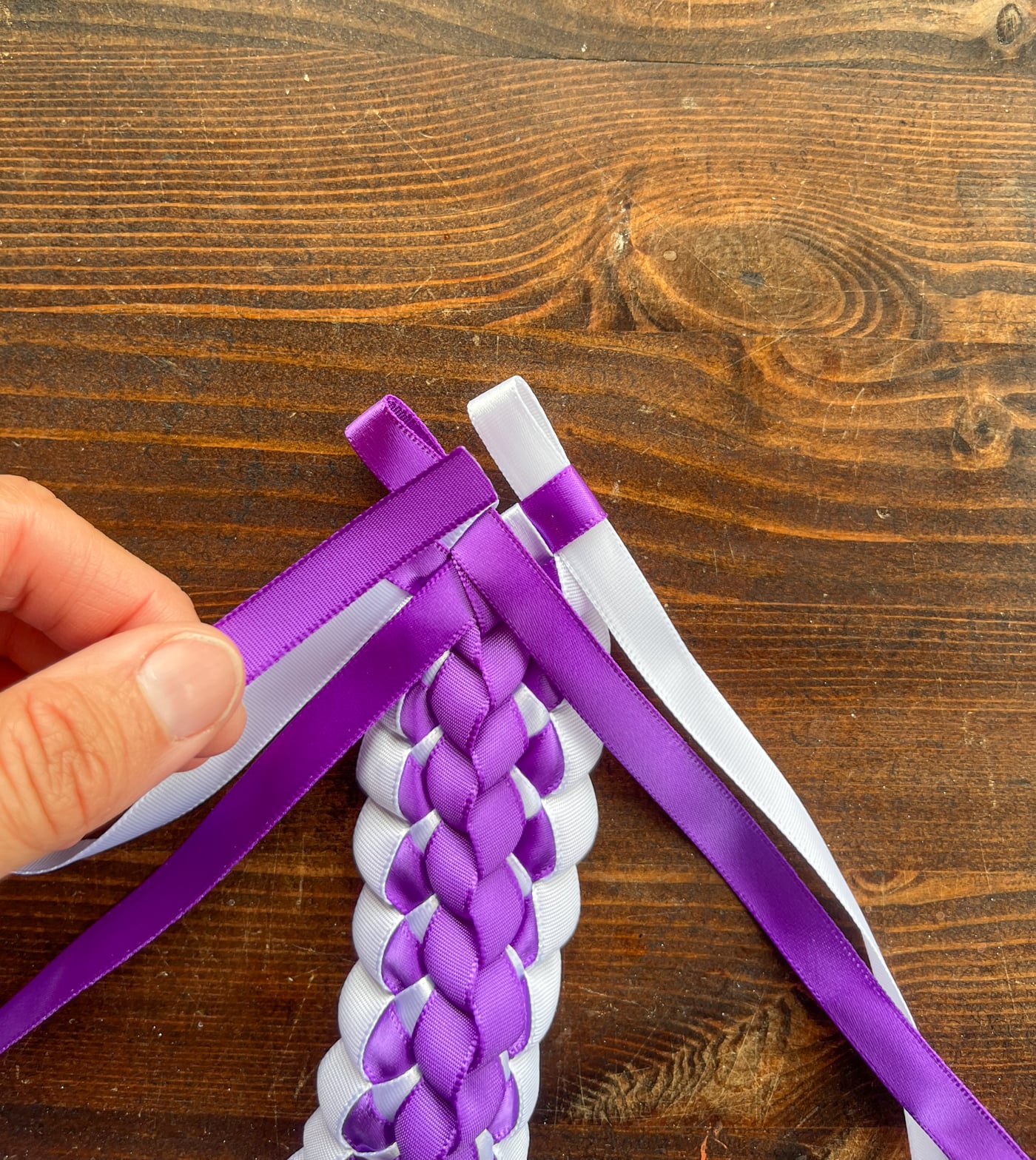securing the ends of a ribbon lei