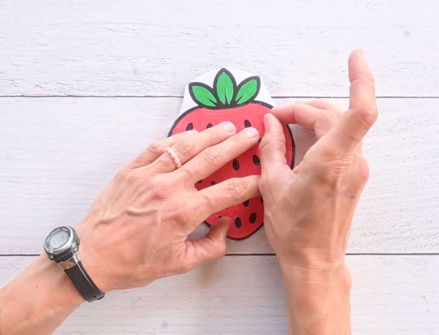 placing two strawberry templates back to back to create a paper squishy