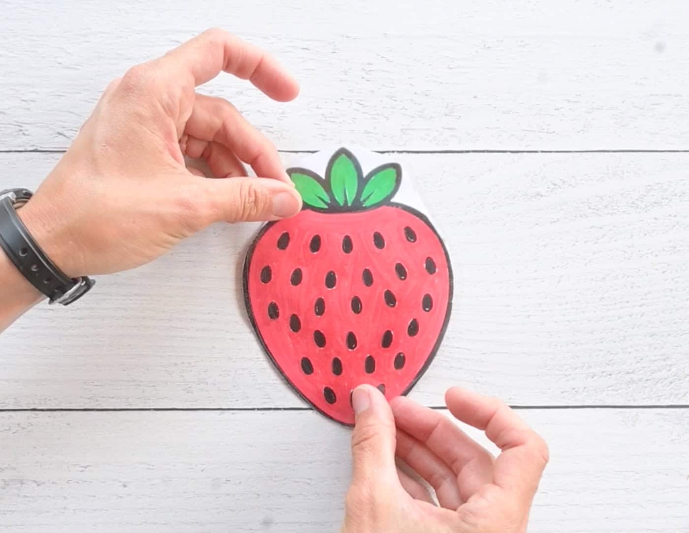 laminating the back of a paper strawberry squishy