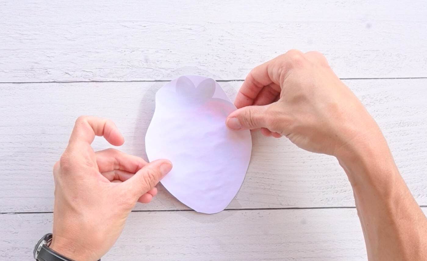 laminating a paper strawberry template with contact paper