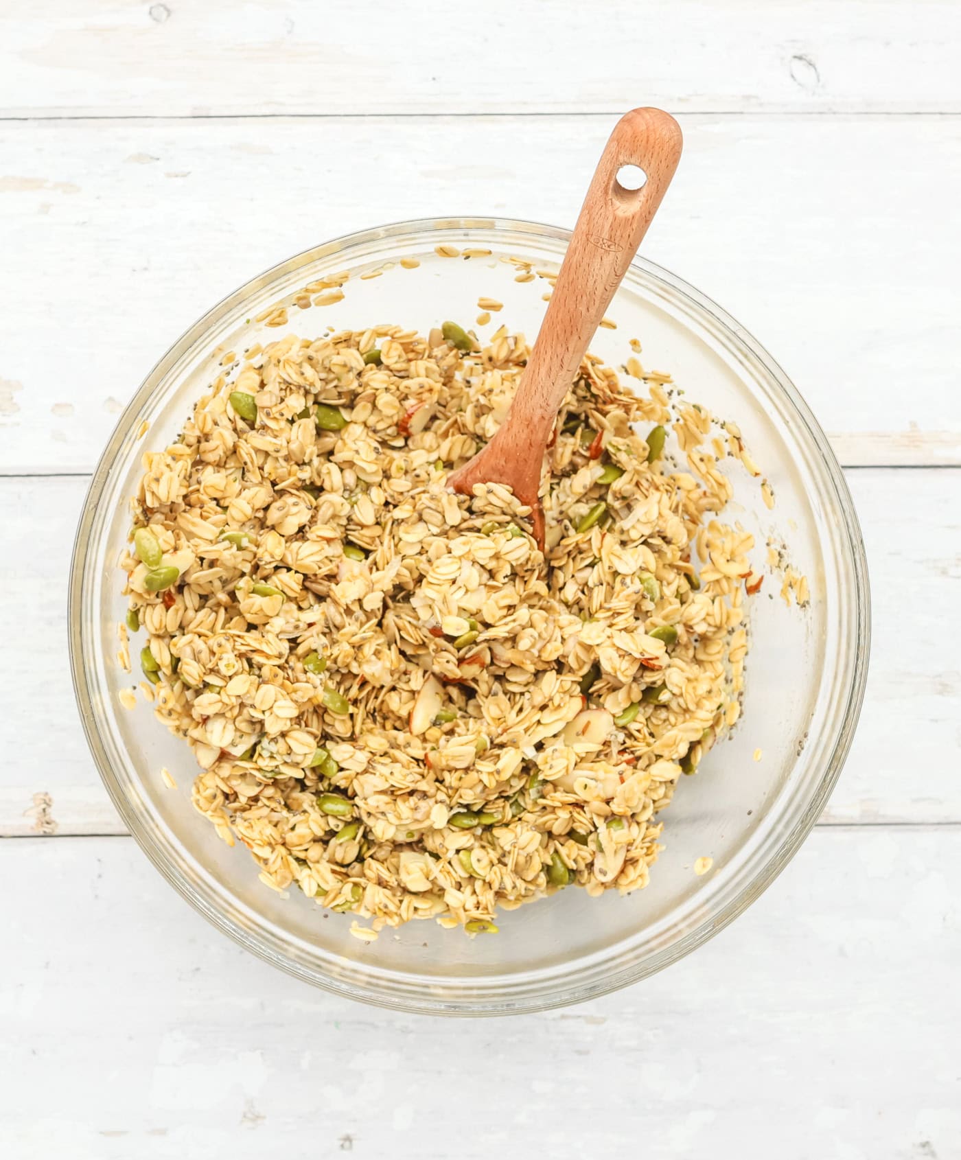 a bowl with mixed granola cookie ingredients