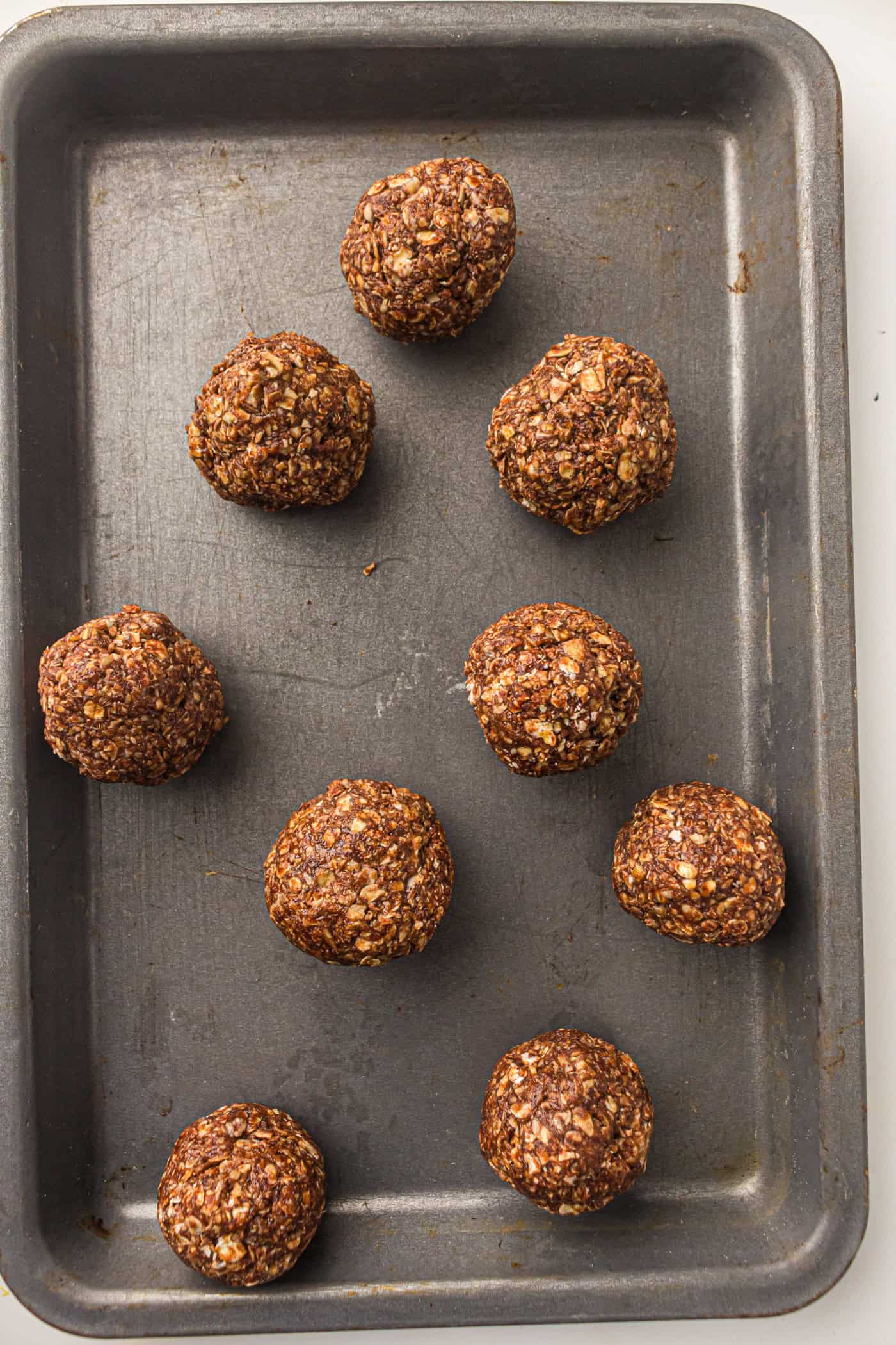 a baking sheet with no bake peanut butter energy balls
