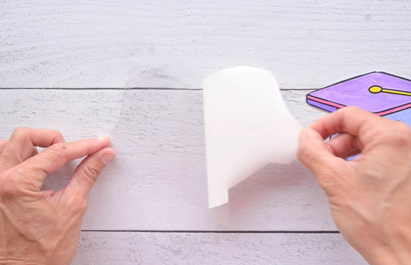 peeling the backing paper off of clear vinyl