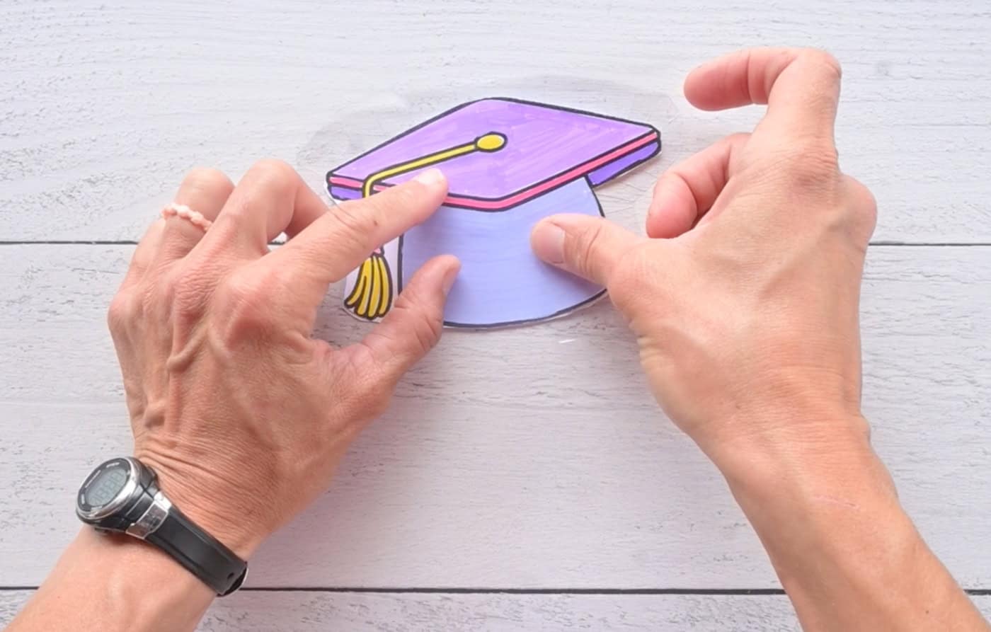 pressing the back portion of a diy paper squishy into place