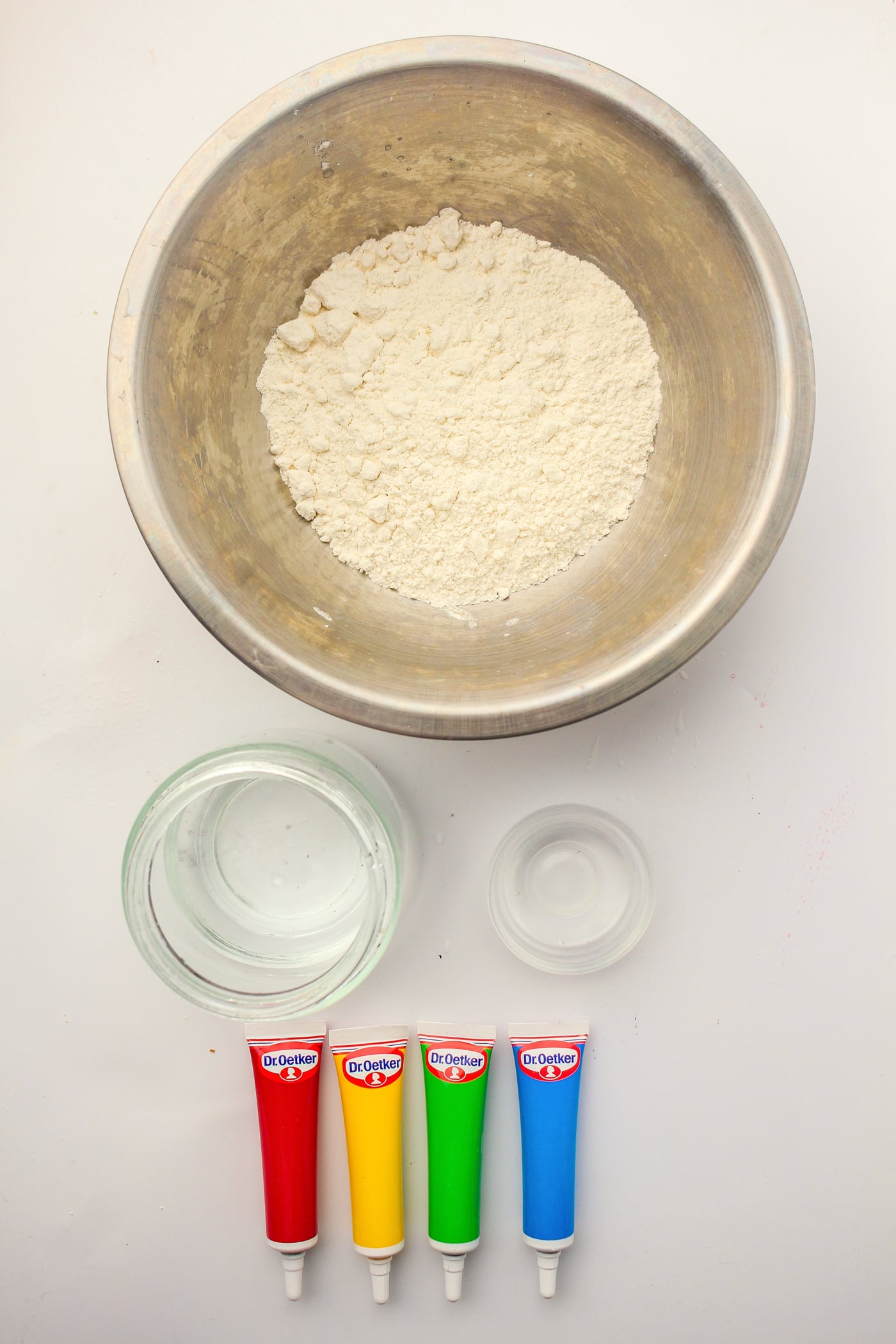 ingredients and materials for DIY puffy sidewalk paint on a white paper background