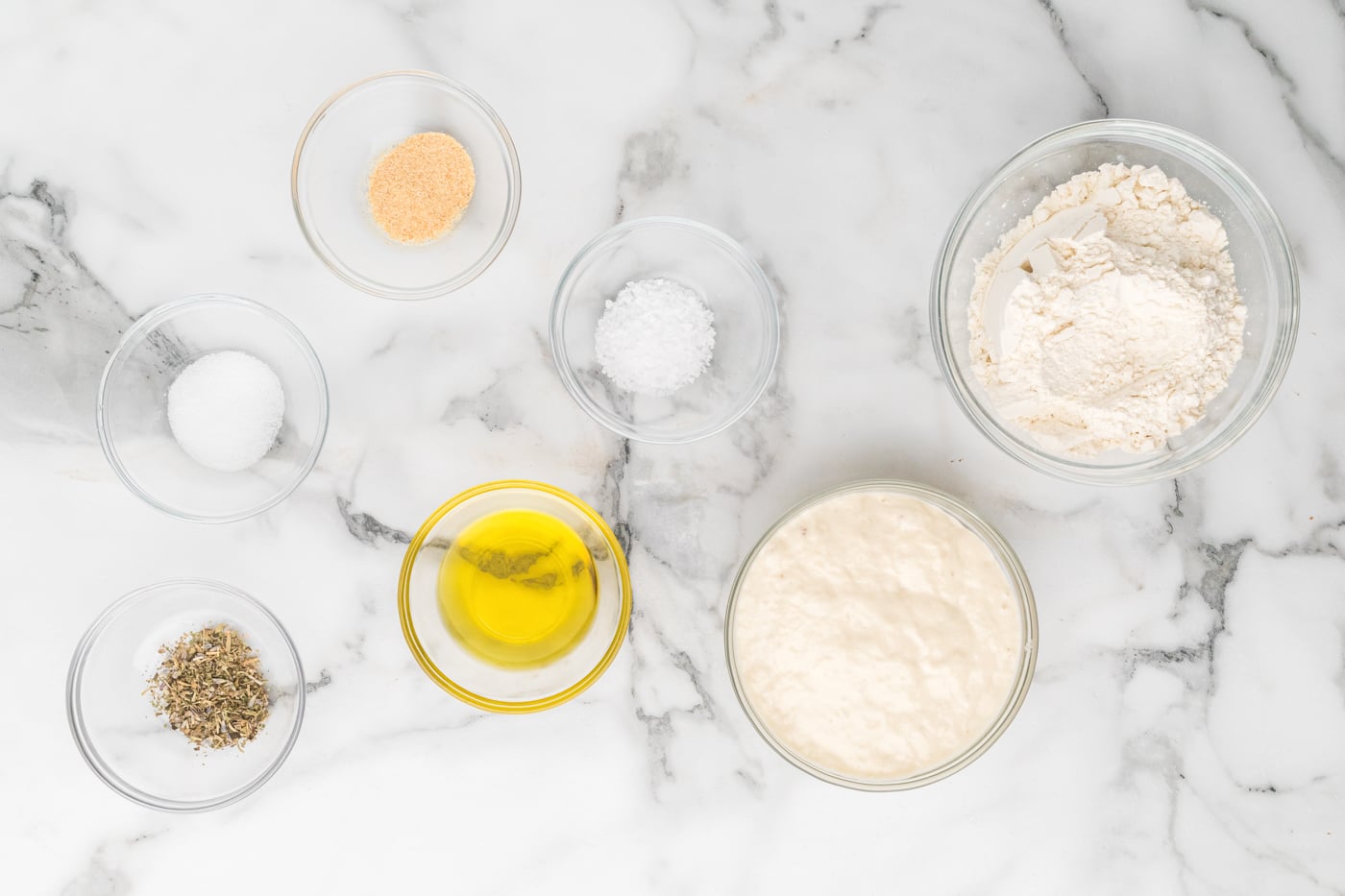 ingredients for sourdough discord crackers on a marble surface