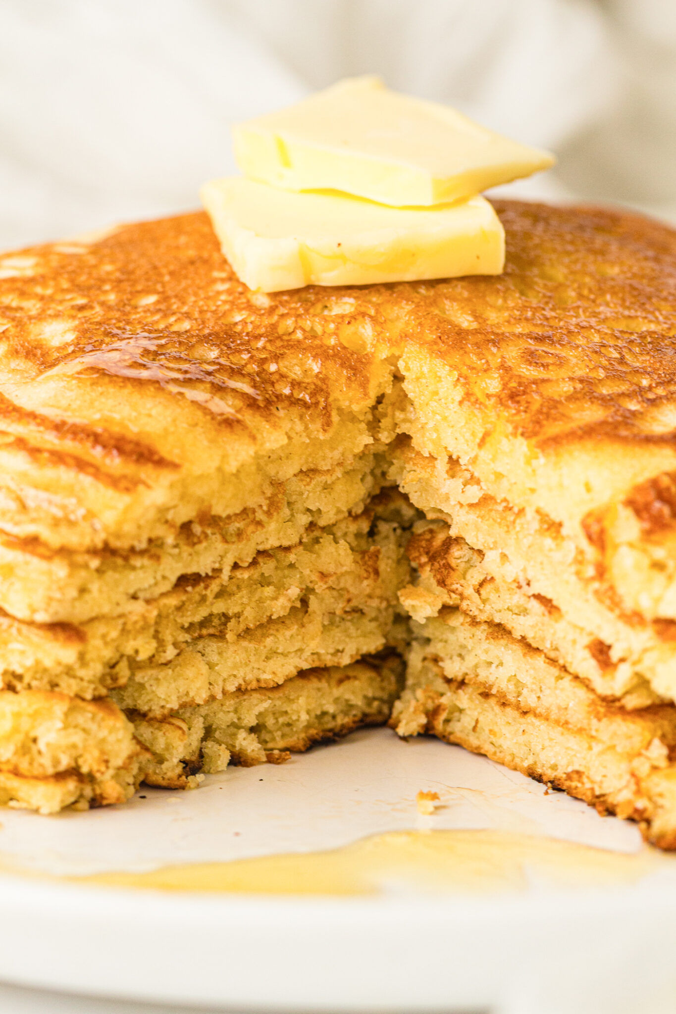 a cut open stack of sourdough pancakes with butter on top