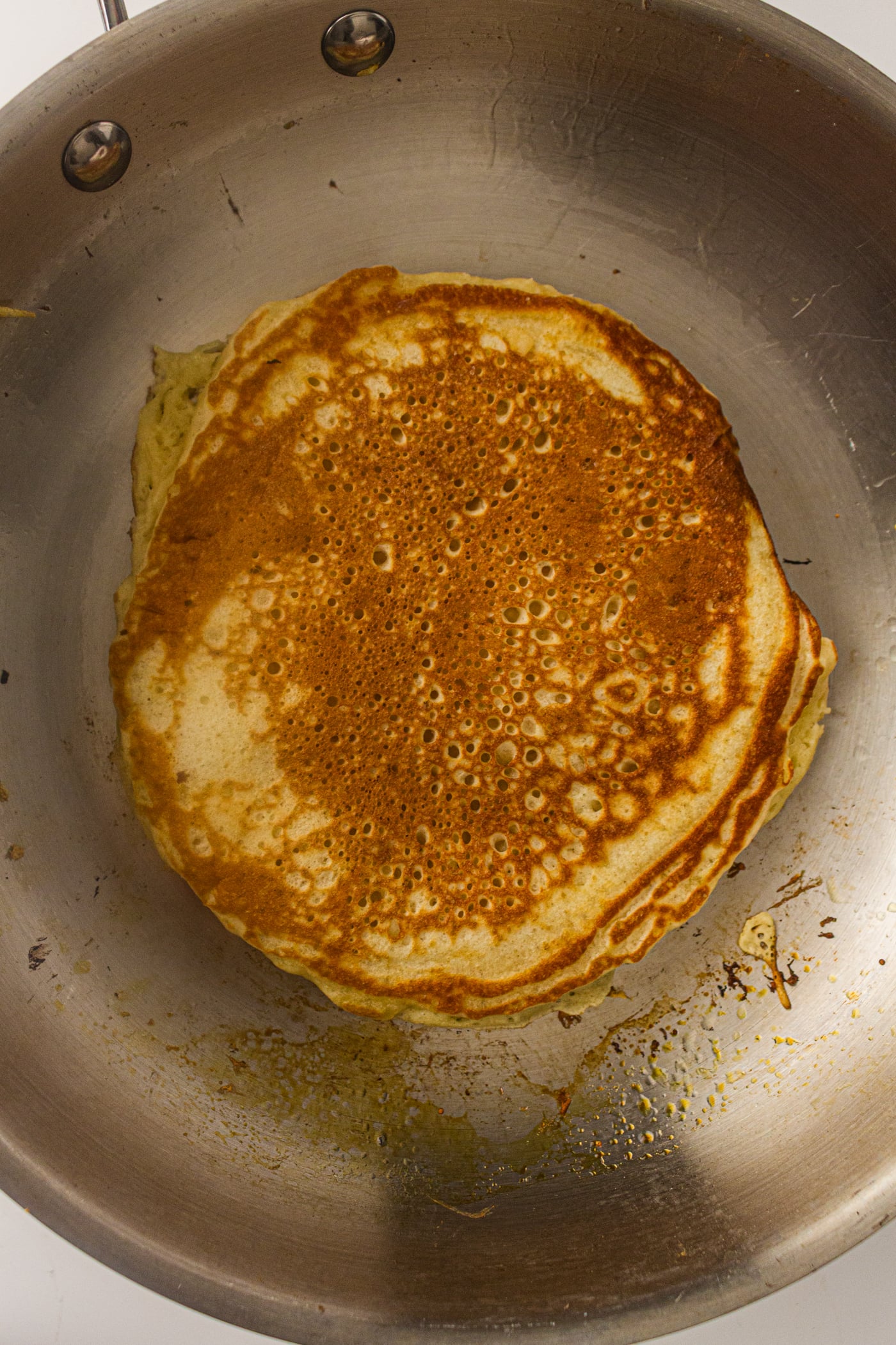 golden brown sourdough pancake in a pan