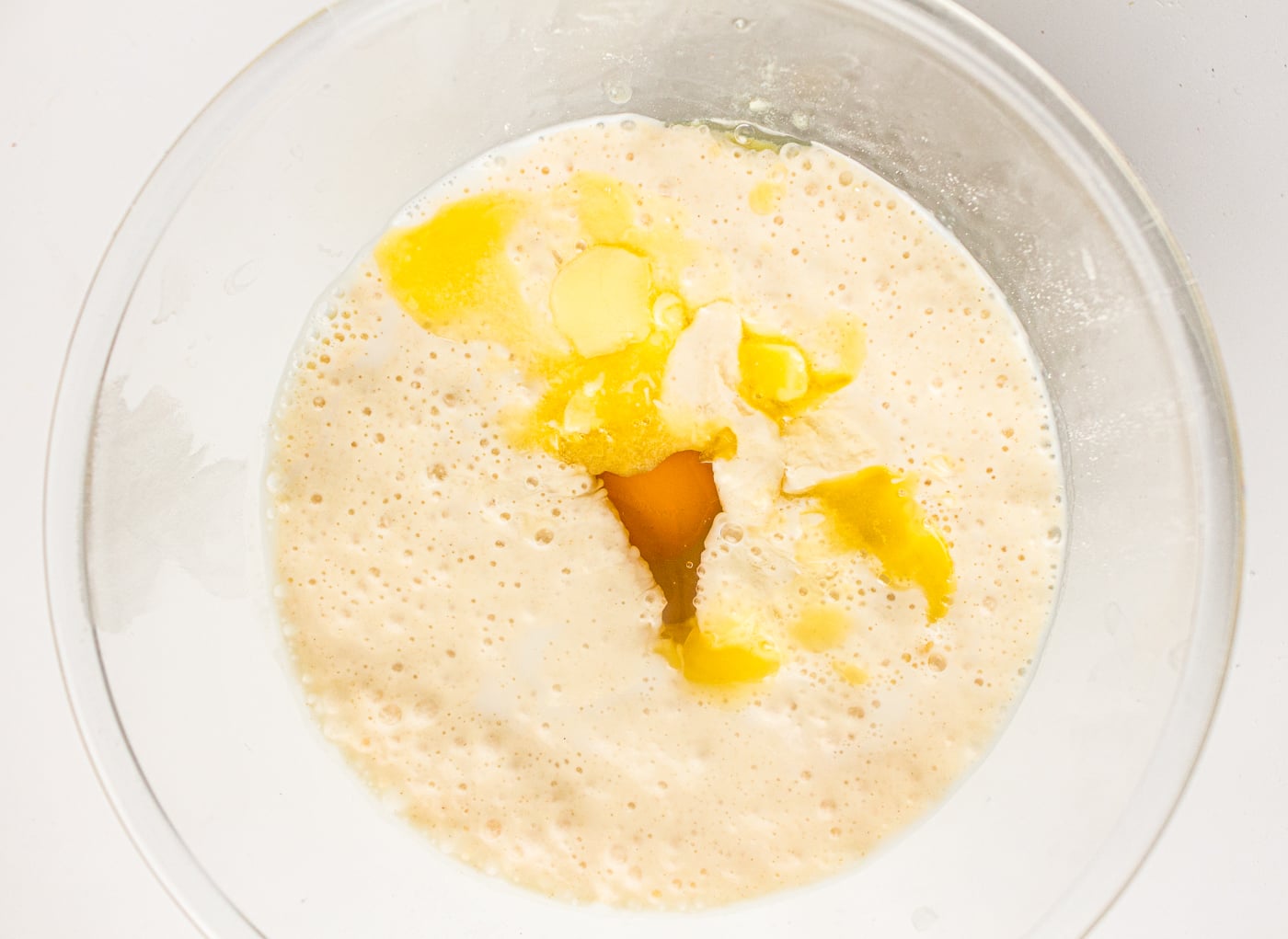 wet ingredients for sourdough discard pancakes in a bowl