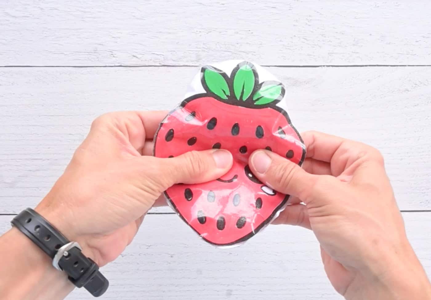 squishing a diy paper strawberry squishy