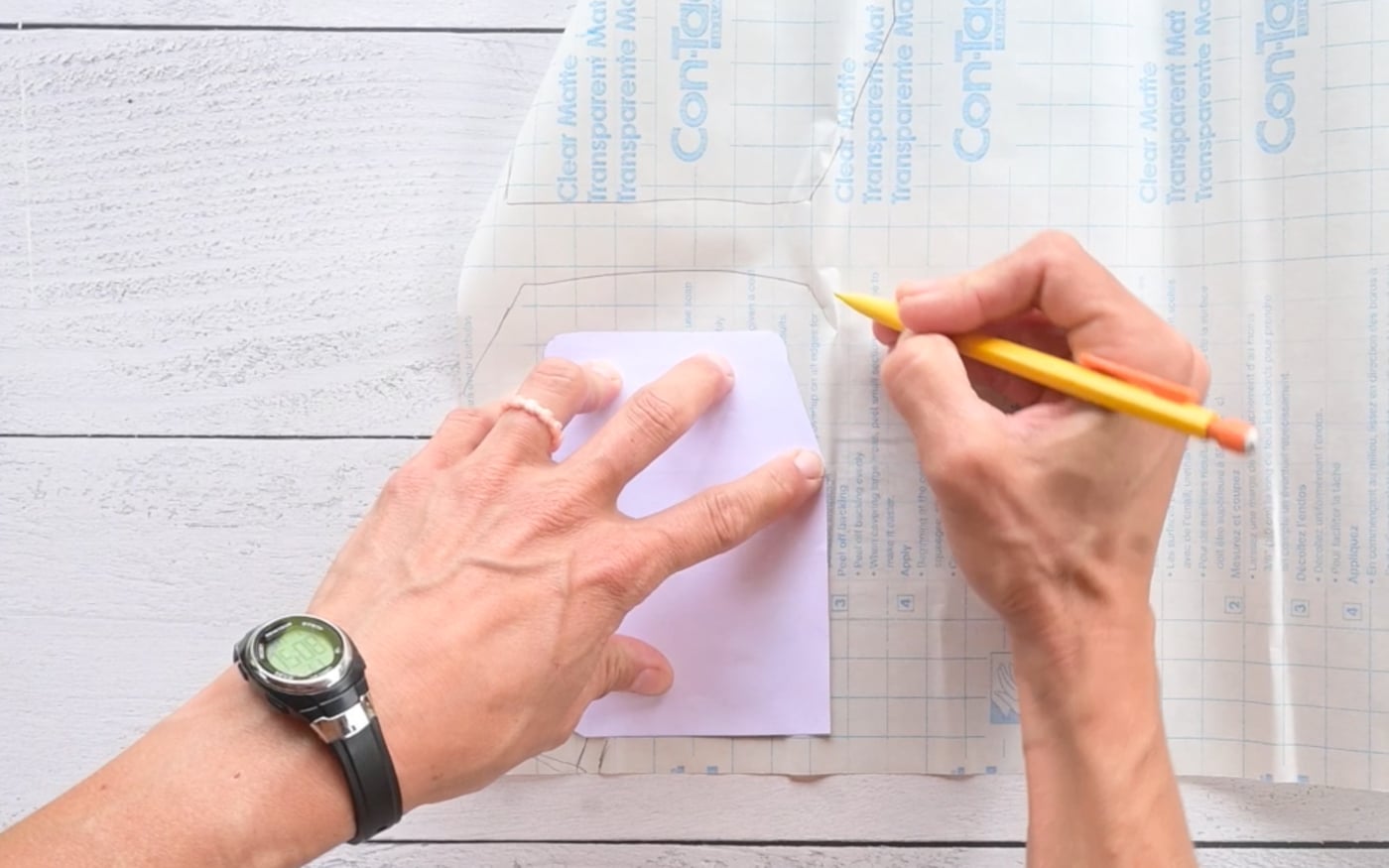 tracing a face down paper squishy template onto contact paper