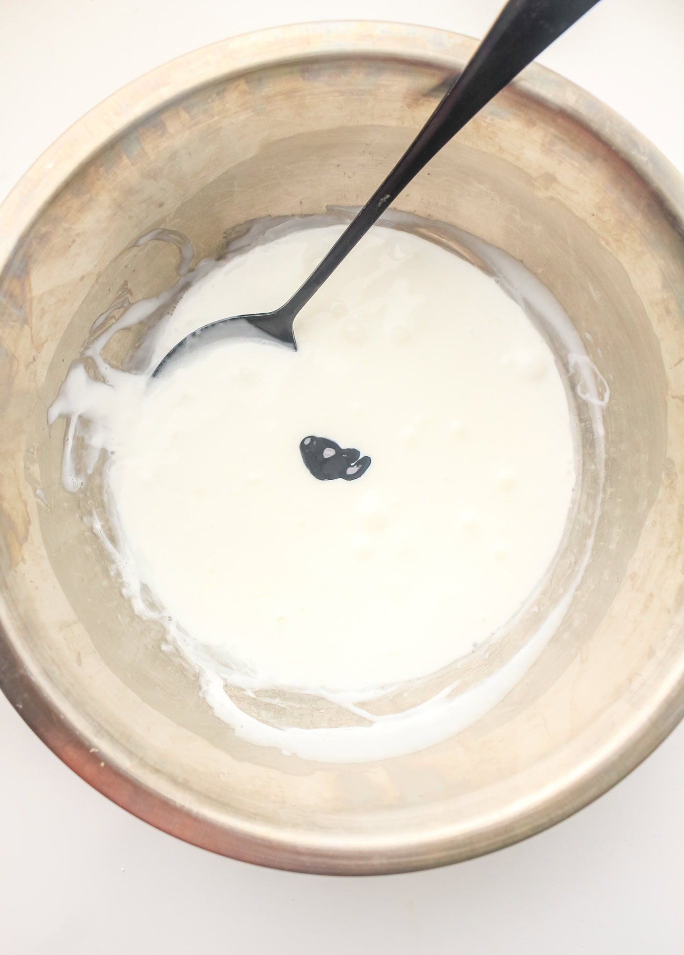 adding food coloring to DIY slime