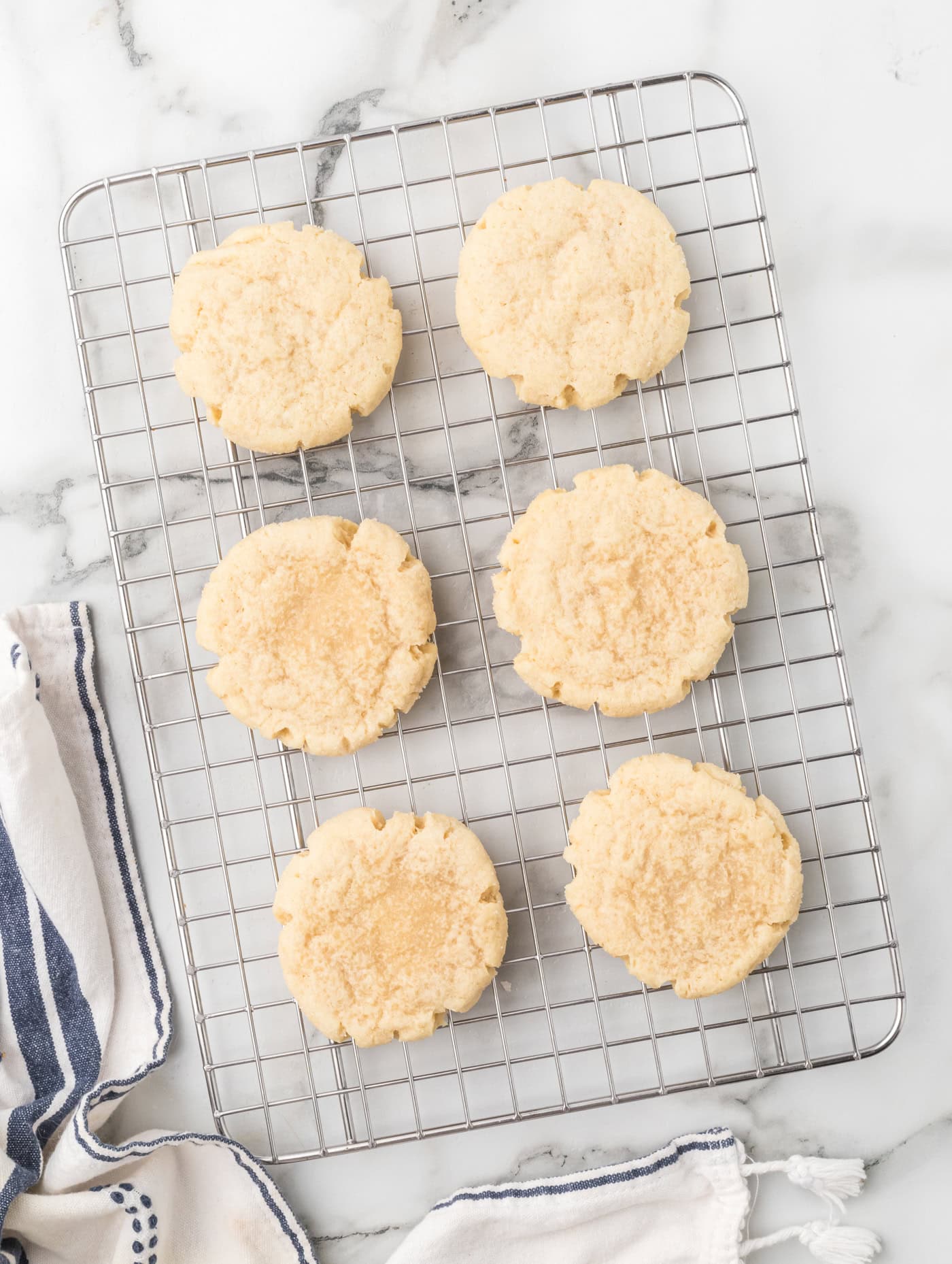 a stop down view of sourdough discard sugar cookies on a wire cooling rack