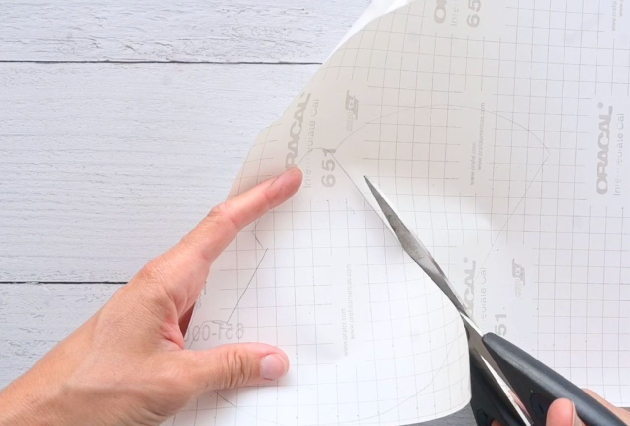 cutting out contact paper for a paper squishy watermelon