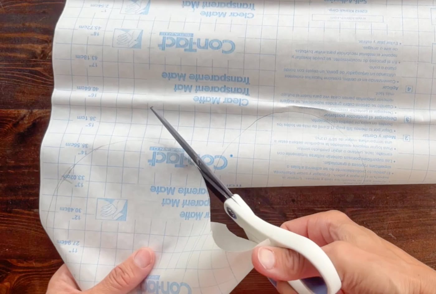 cutting out contact paper for a diy paper squishy