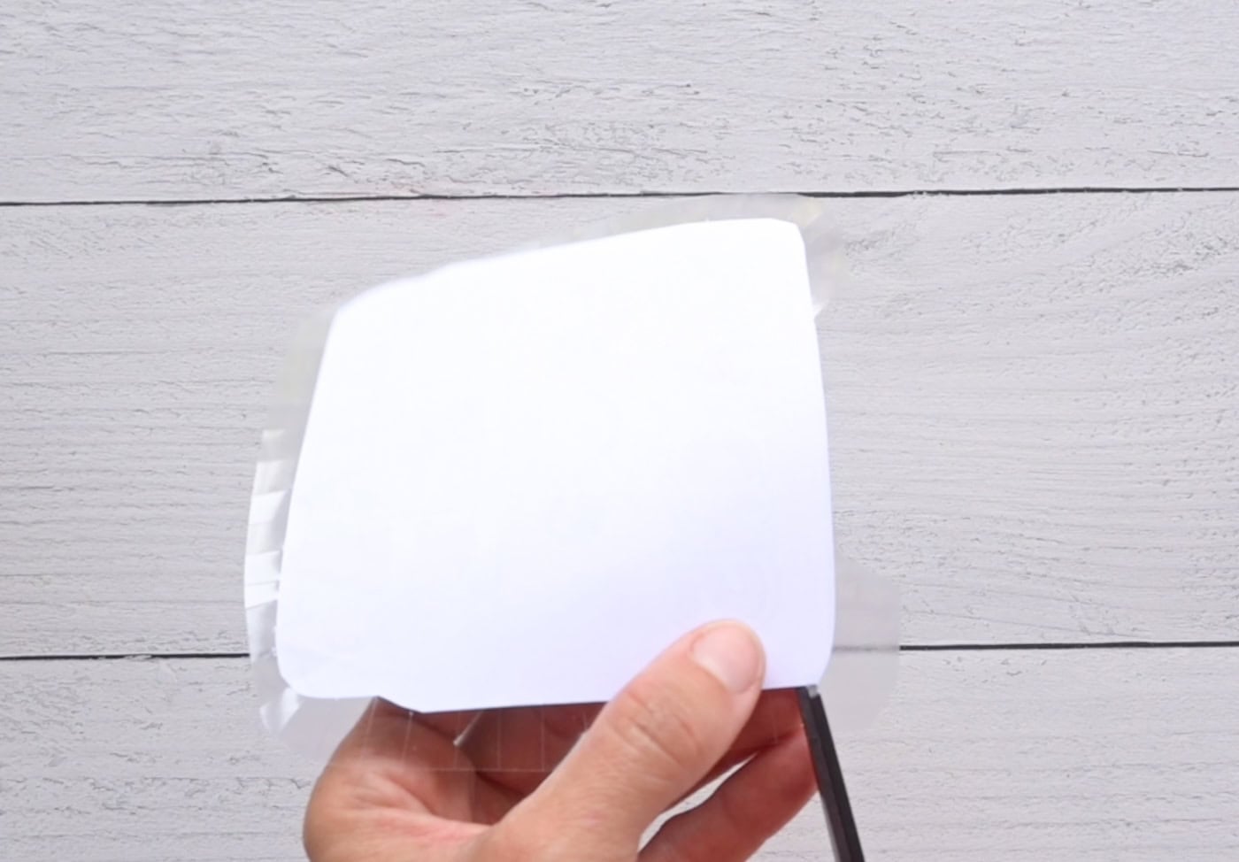 cutting tabs in contact paper to make a diy paper squishy
