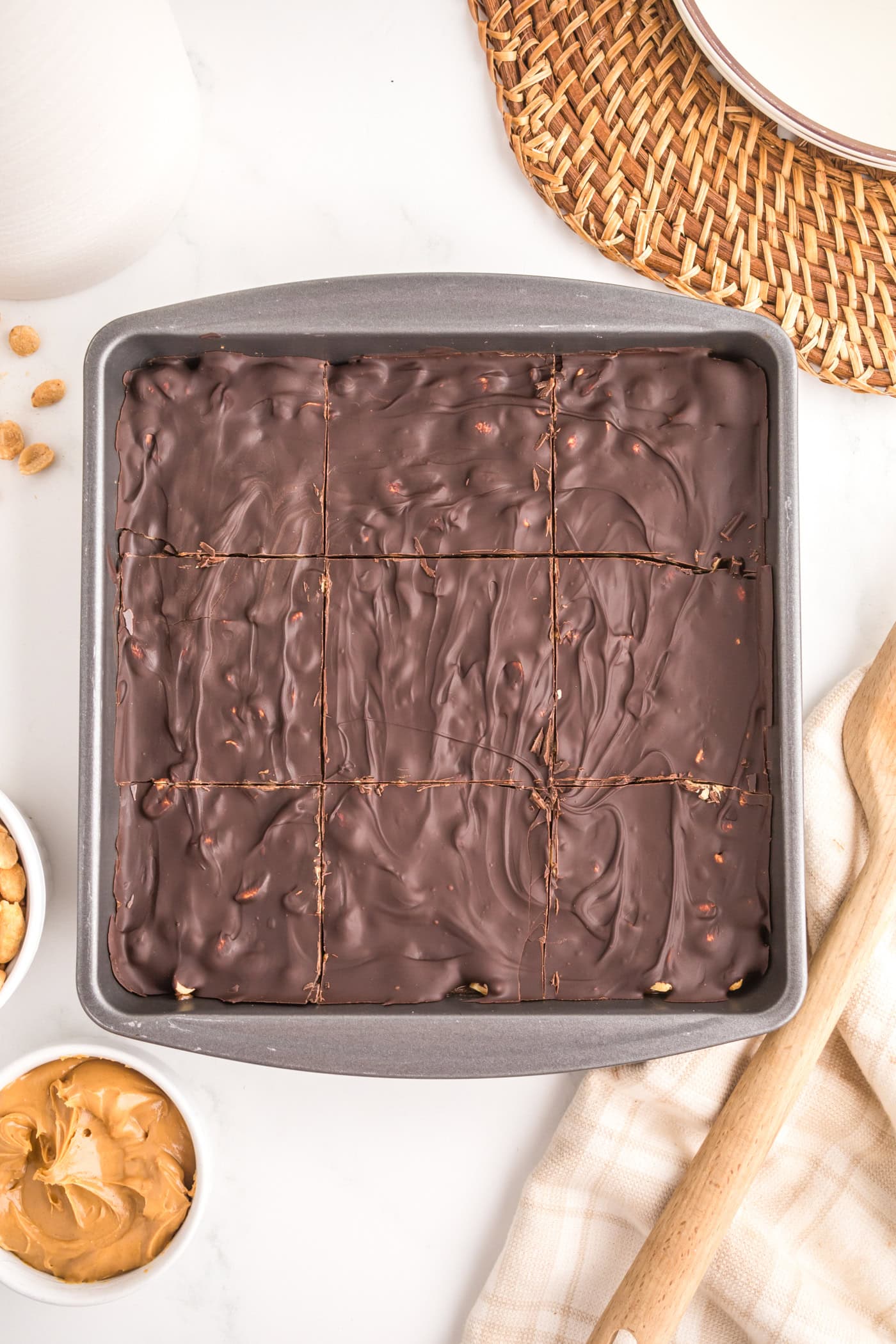 a pan of dairy free healthy snickers bars