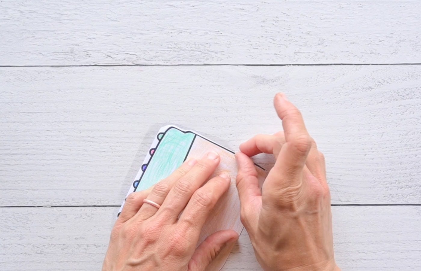 taping the pieces for a paper crayon squishy together