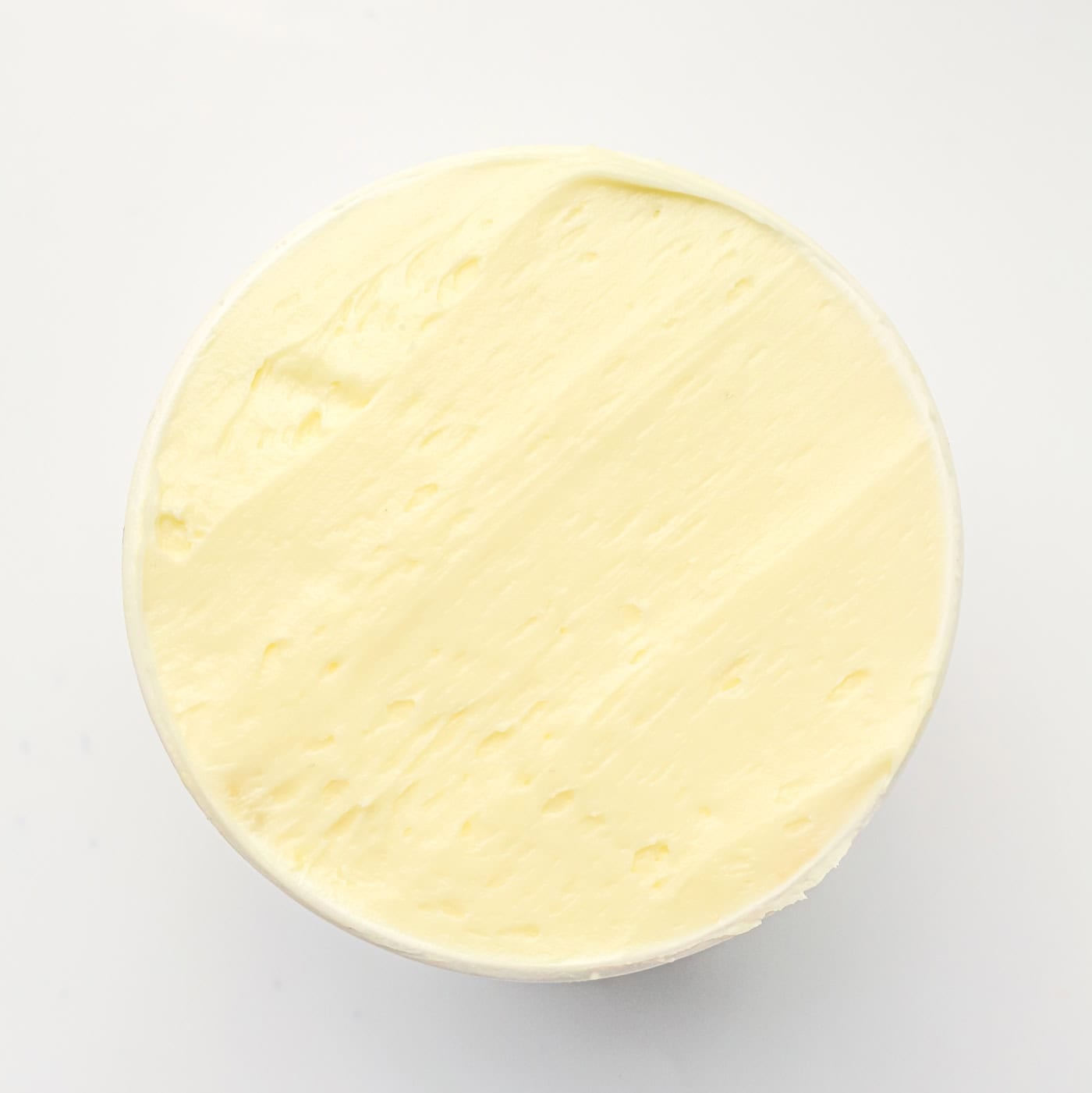 a frosted gluten free dot cake on a white background