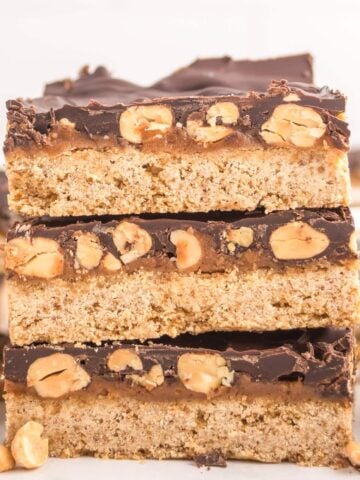 a stack of three dairy free copycat Snickers bars