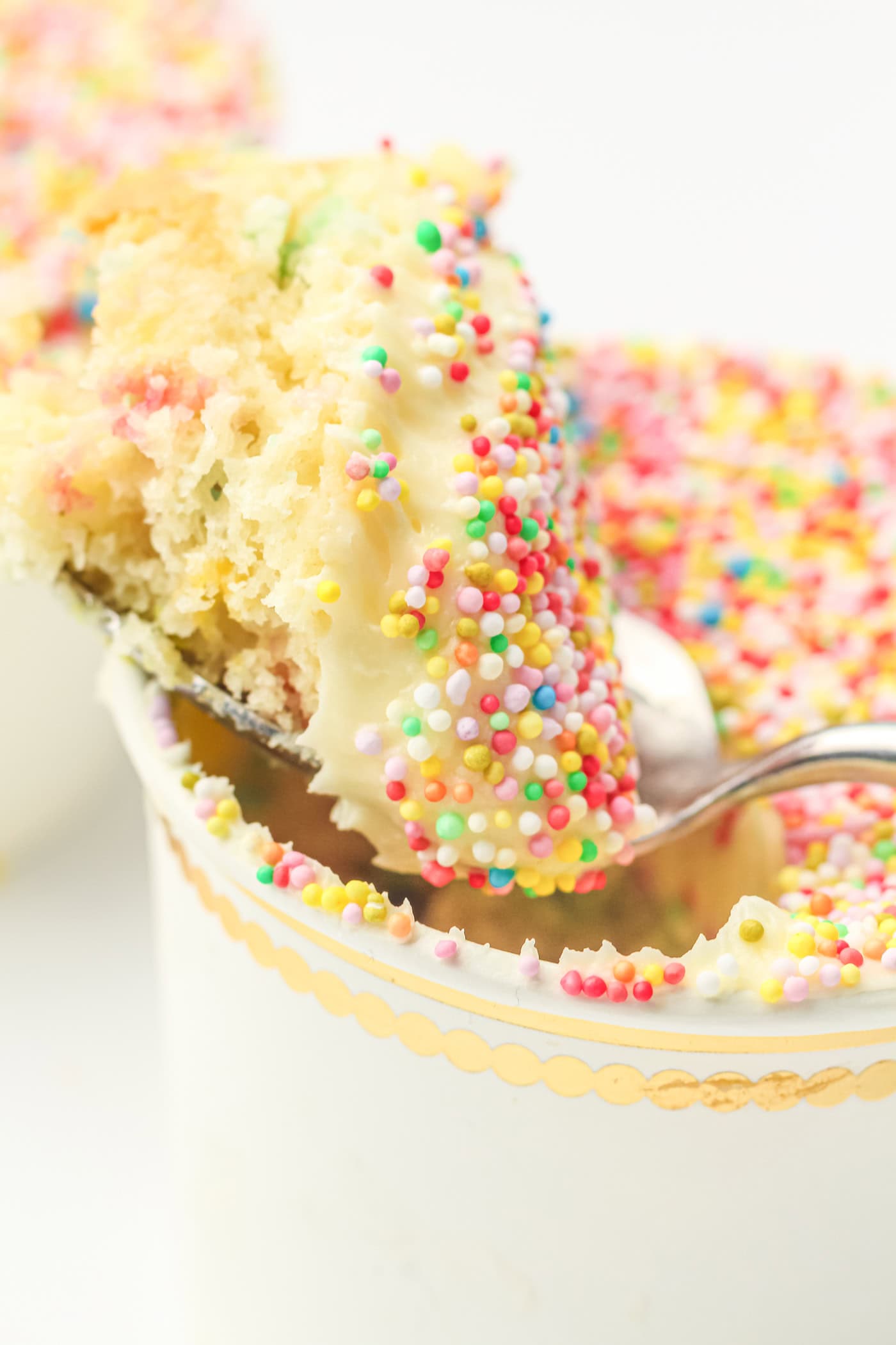 a spoon full of gluten ree sprinkle crunch cake