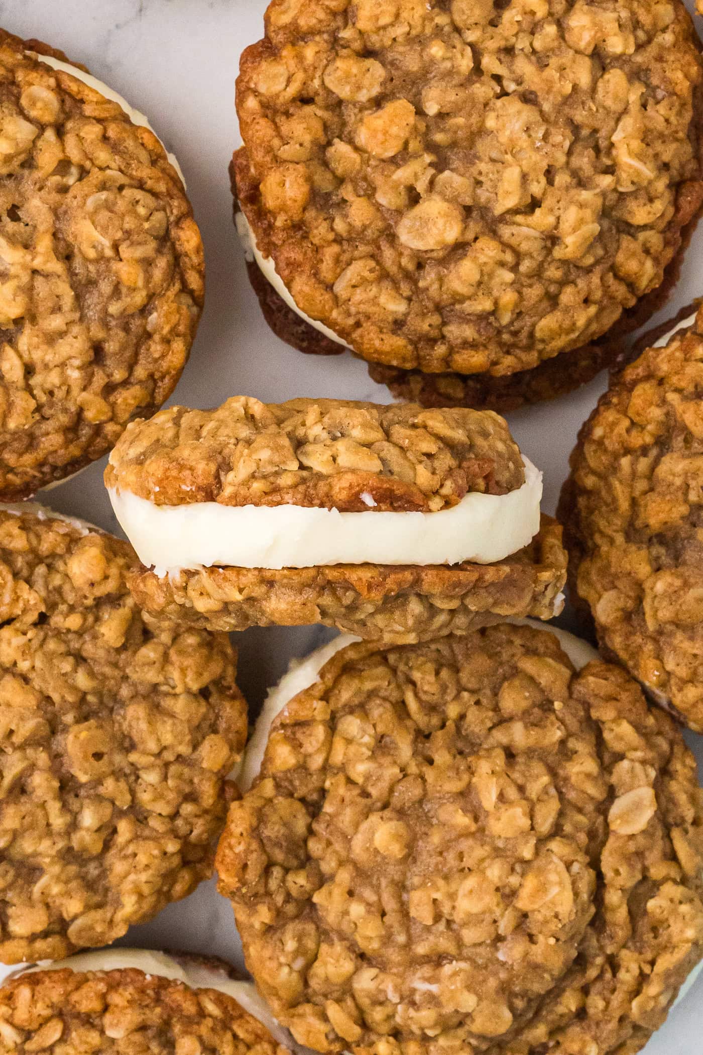 a close up photo of half a dozen homemade oatmeal cream pies