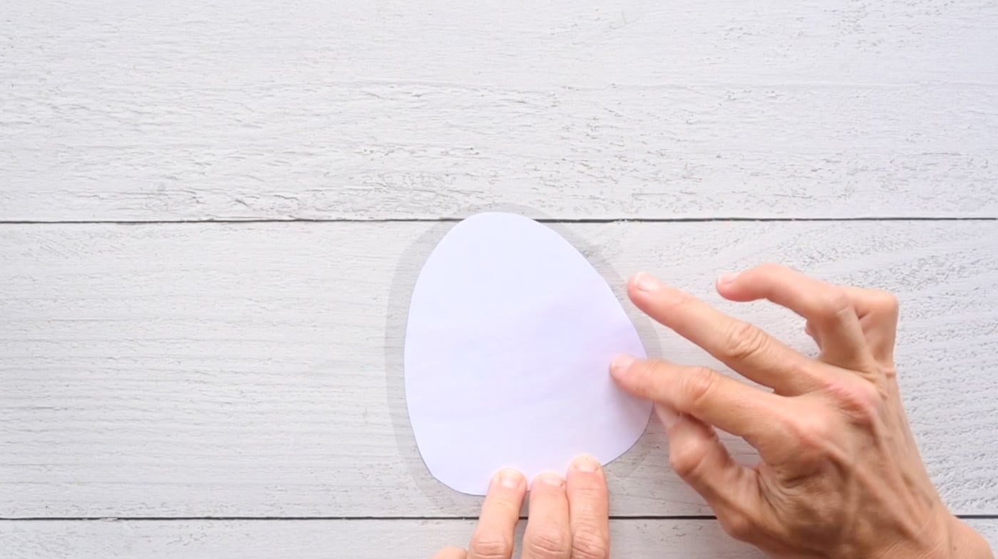laminating the front piece of a diy paper candy corn squishy