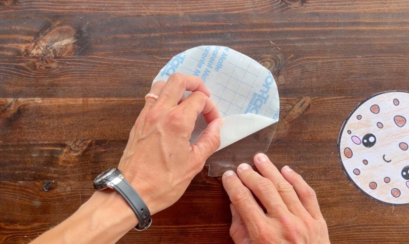 peeling the backing paper off contact paper