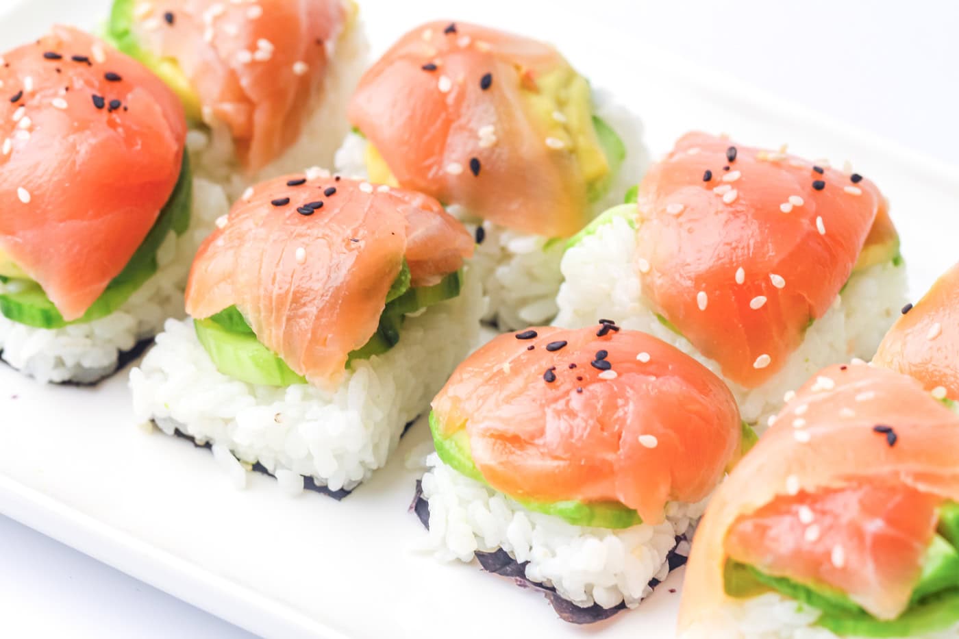 a tray of ice cube tray sushi salmon roll2