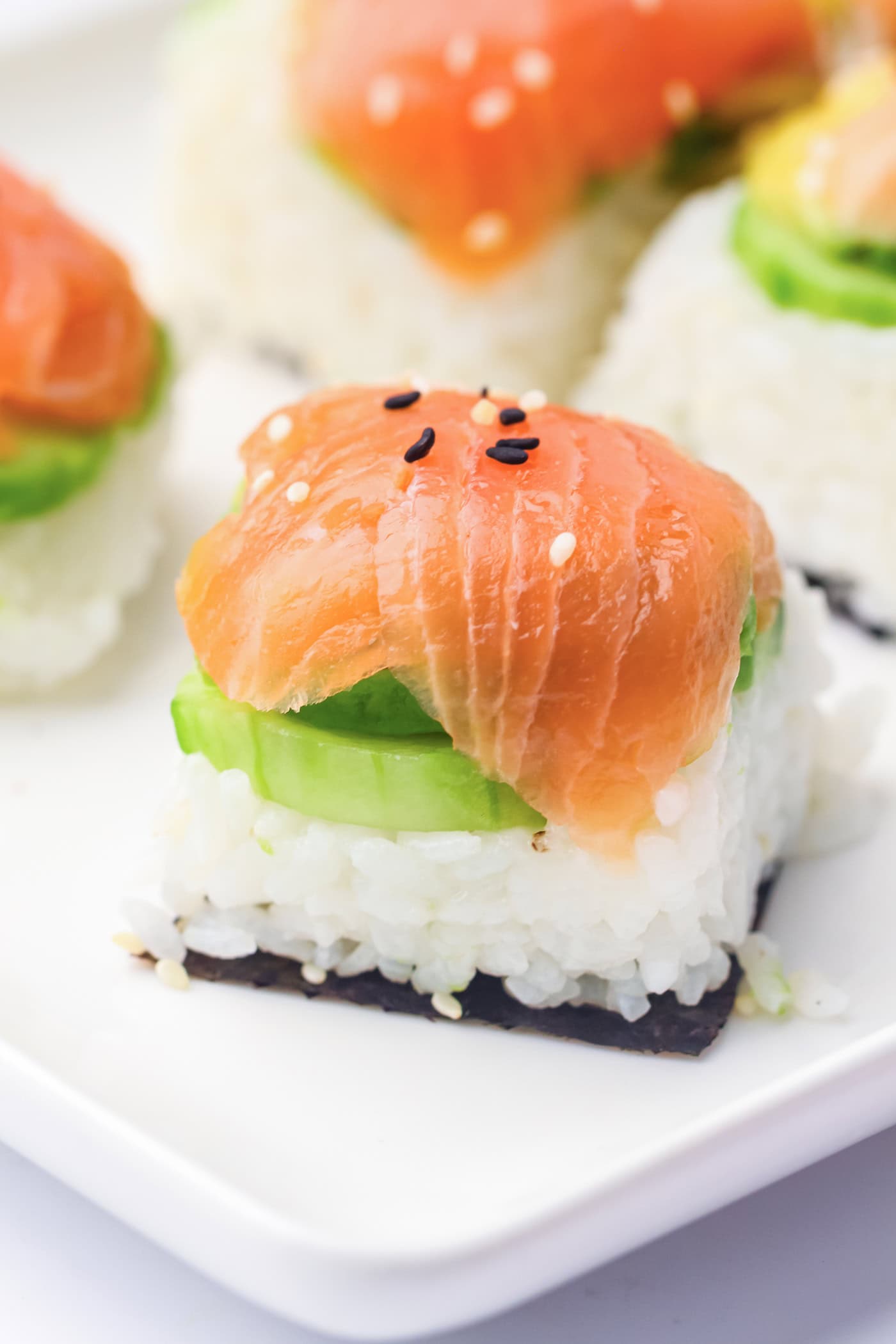 ice cube tray sushi salmon rolls with sesame seeds