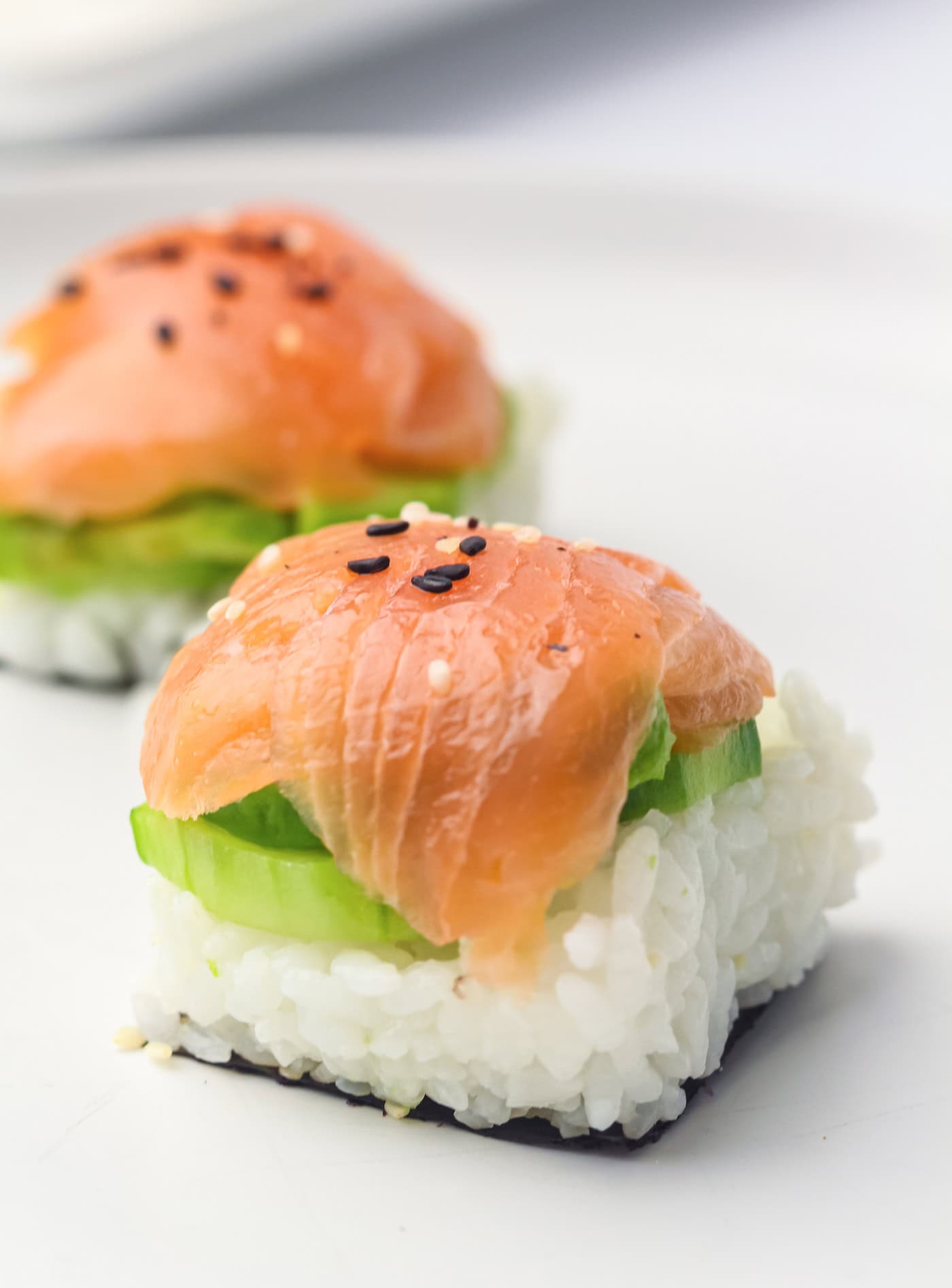 ice cube tray sushi salmon rolls with sesame seeds