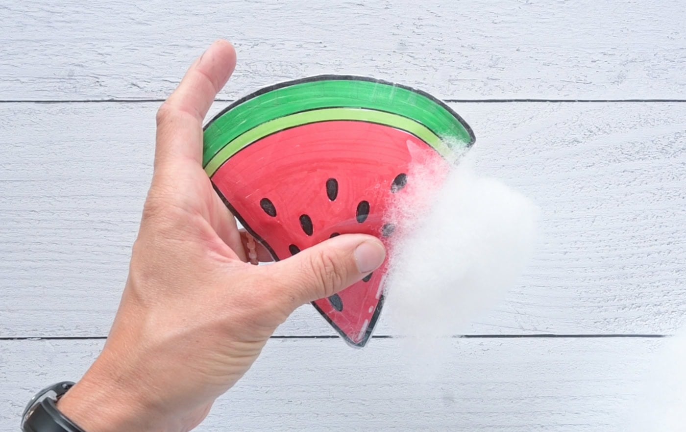 stuffing a paper squishy watermelon
