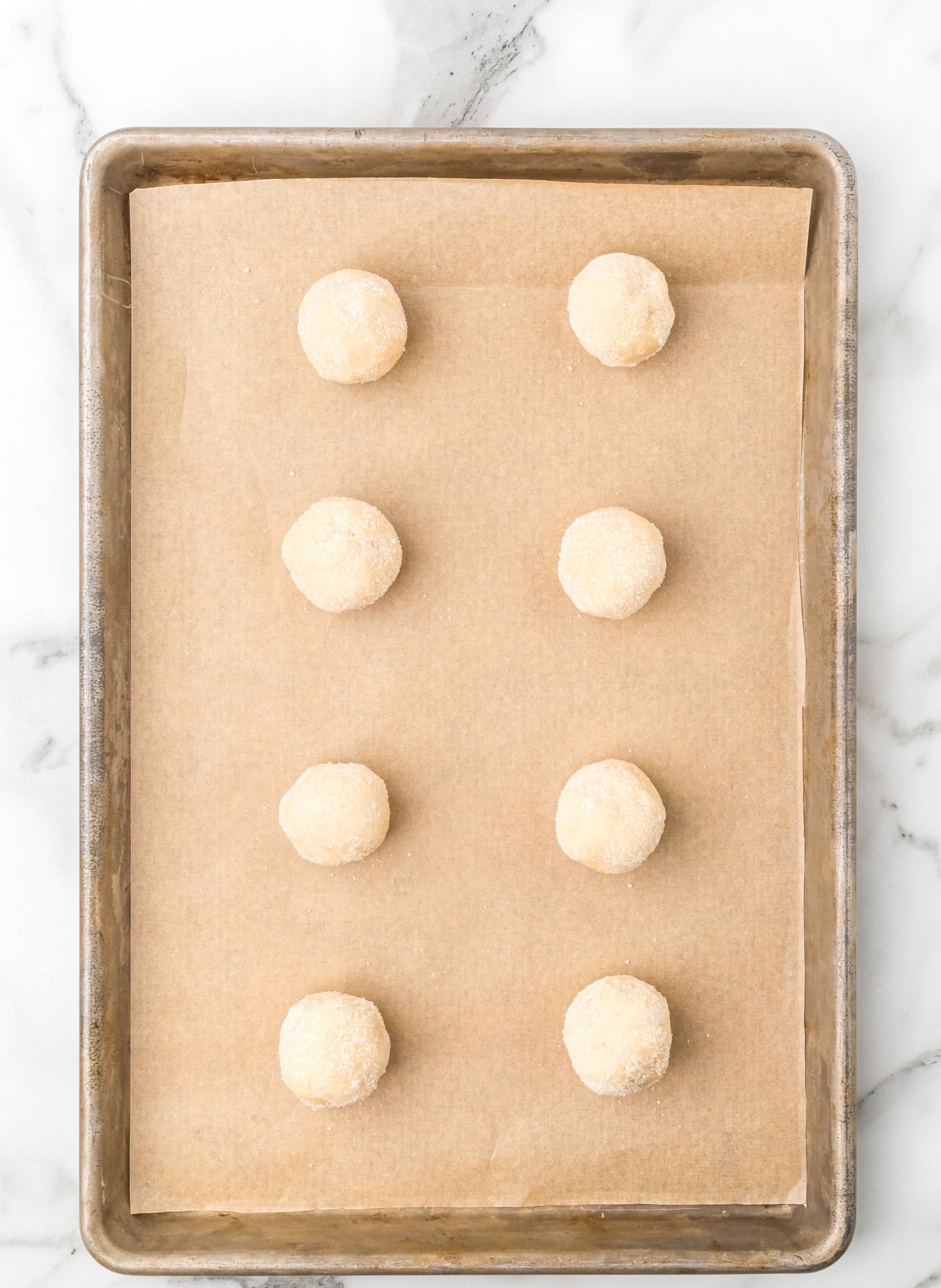 sourdough discard sugar cookies on a baking sheet before being flattened