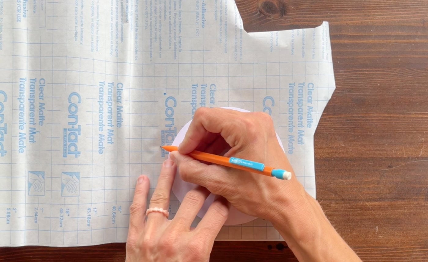tracing a cookie shape onto contact paper
