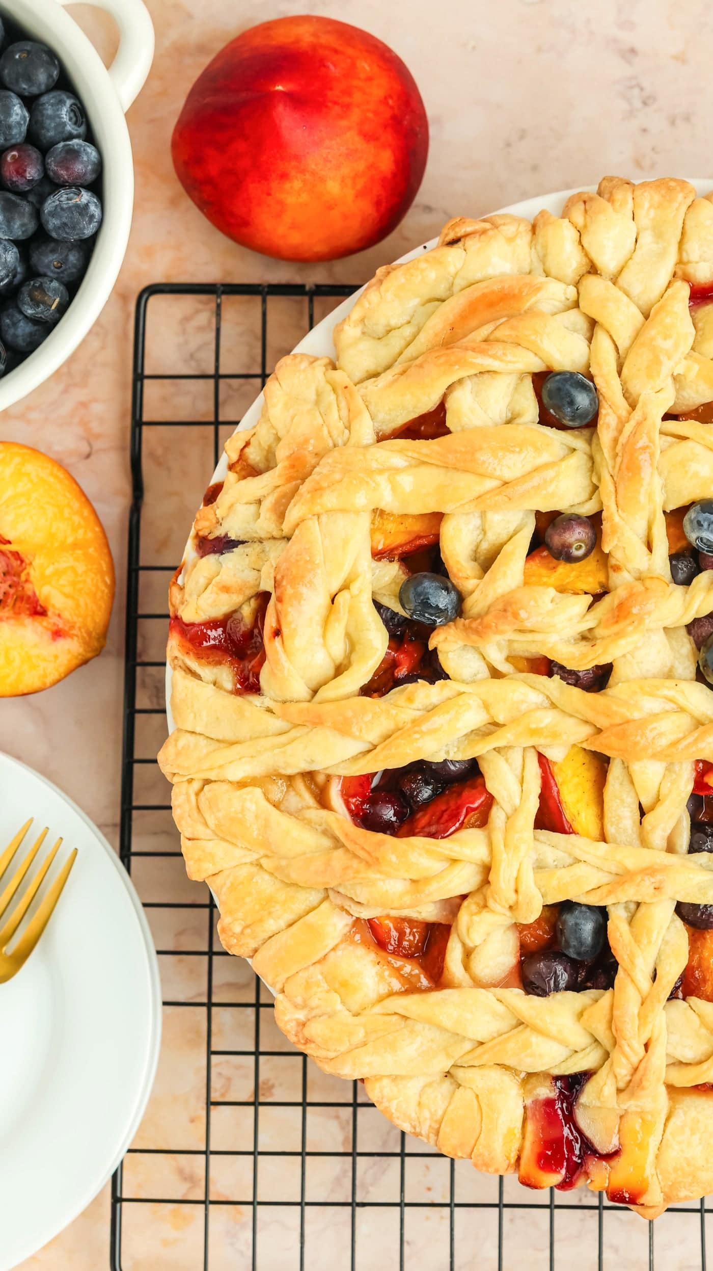 a top down photo of a baked fresh peach pie