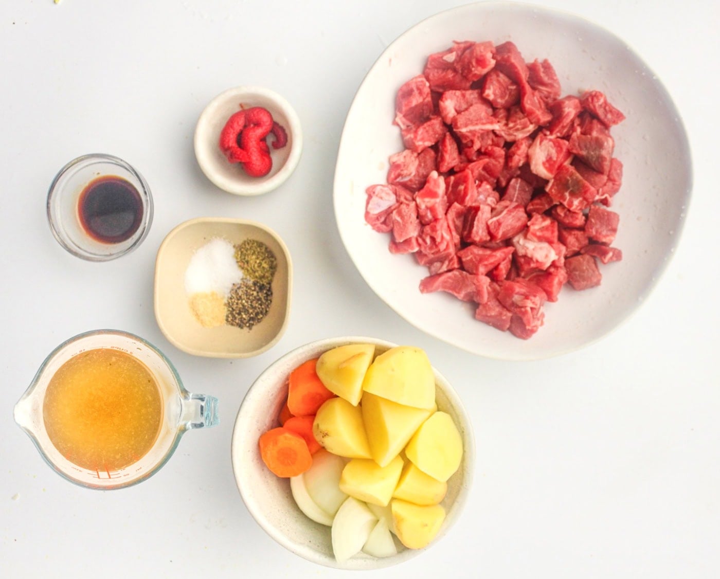 ingredients for beef stew mis en place with beef, potatoes, and veggies