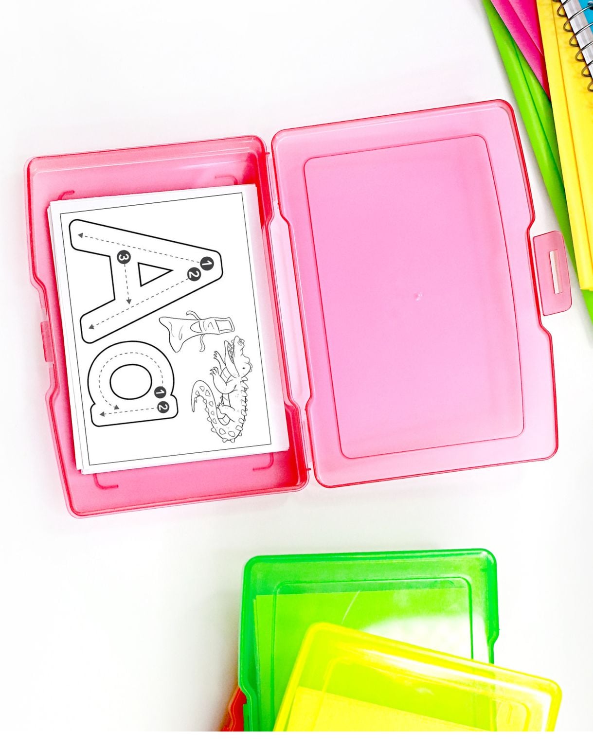 a pink task box with a letter a tracing card