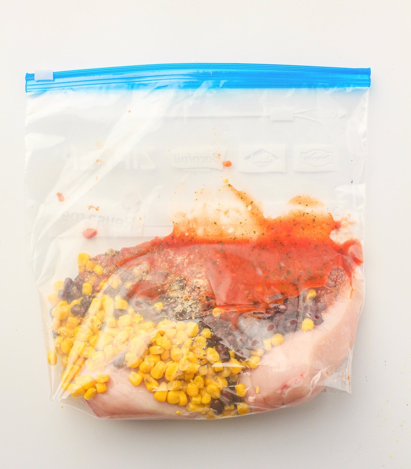 ingredients for salsa slow cooker chicken in a dump bag ready for the freezer or cooking