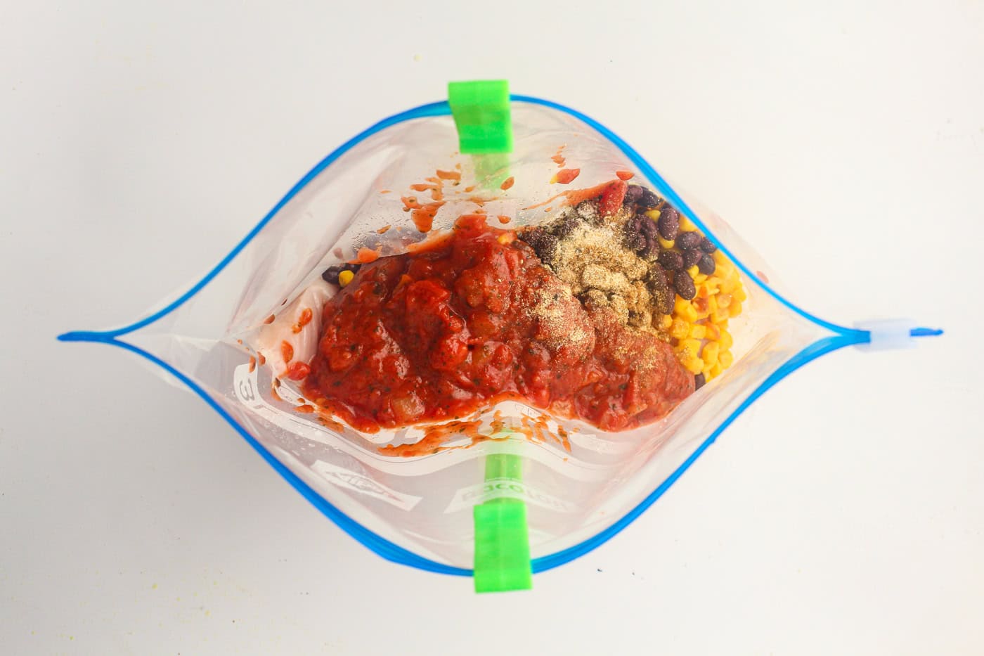ingredients for salsa slow cooker chicken in a gallon ziplock bag