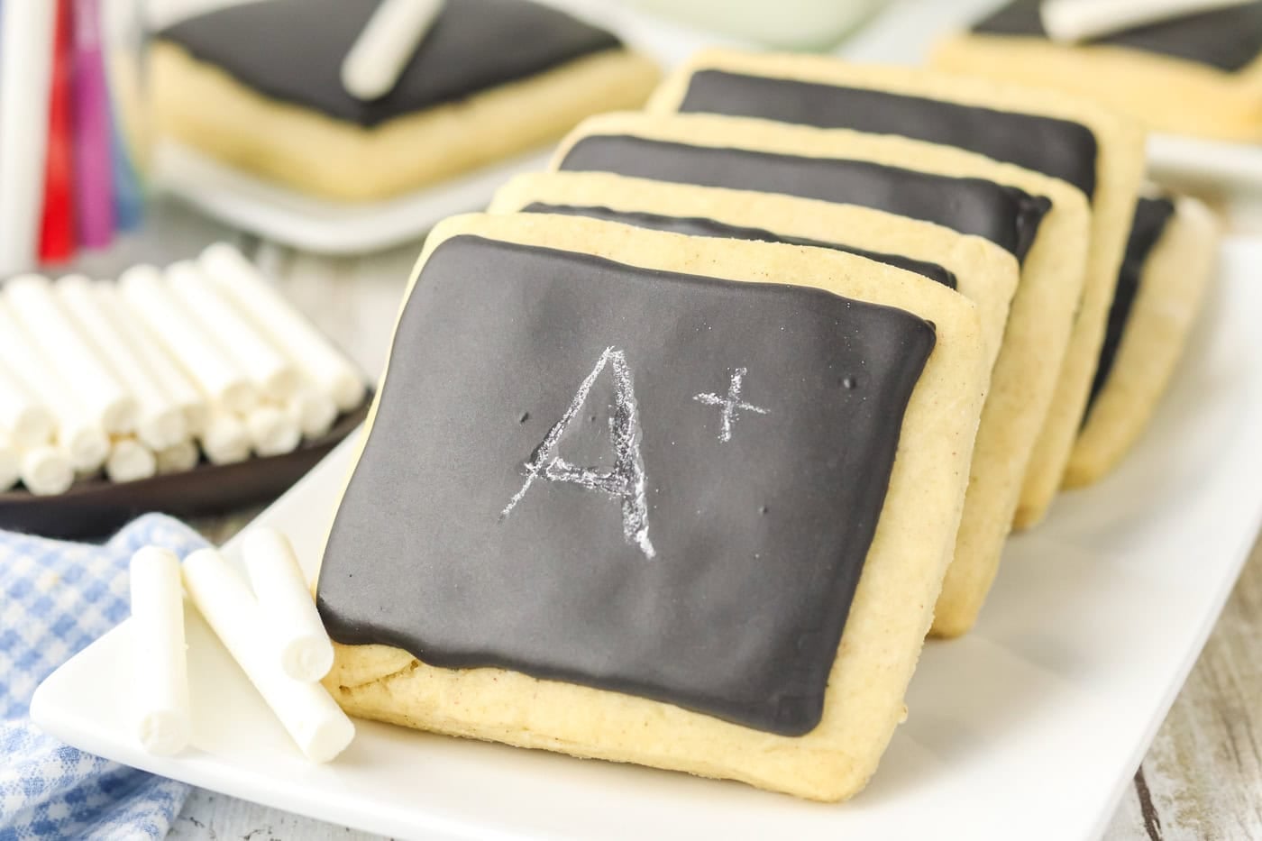 a stack of chalkboard sugar cookies with "A+" on the front cookie