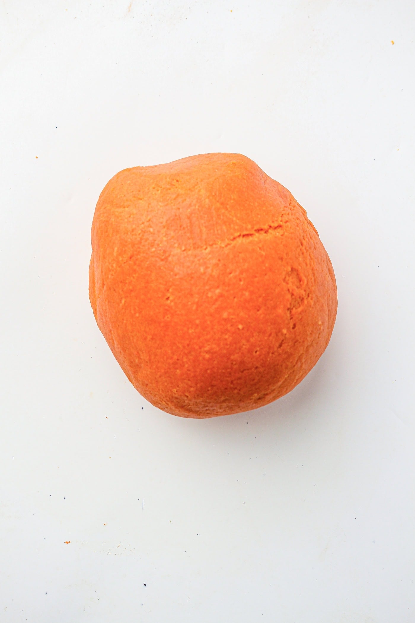 a ball of homemade fall play dough for sensory play