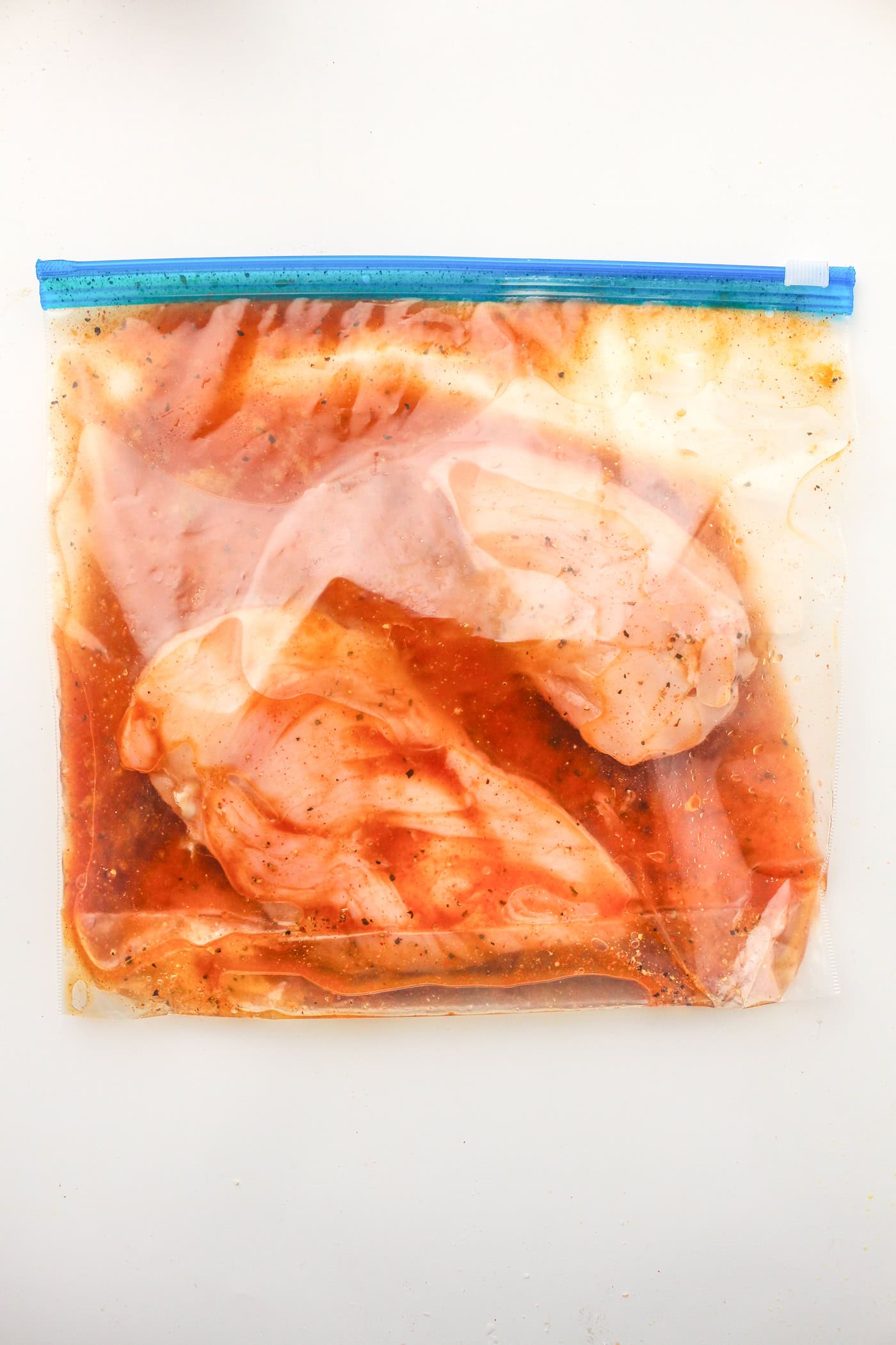raw ingredients for slow cooker honey bbq chicken freezer dump meal