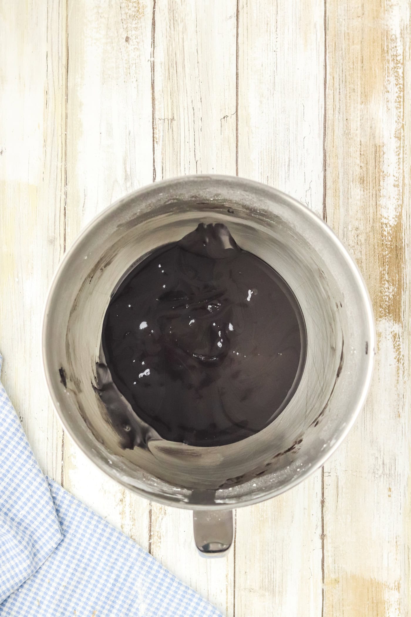 black royal icing in a bowl